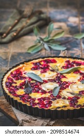 Cranberry Goat Cheese Tart With Sage On Rustic Blue Background, Vertical