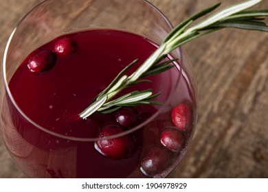 Cranberry Juice In Gin Goblet Glass On Wooden Tabla 