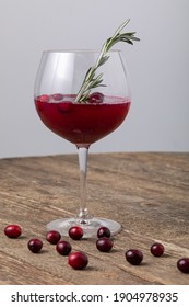 Cranberry Juice In Gin Goblet Glass On Wooden Tabla 