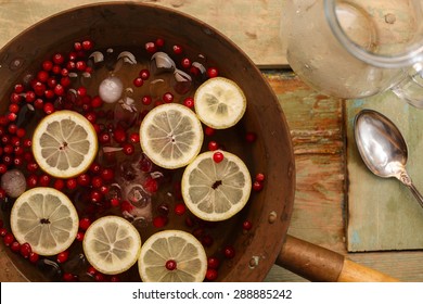 Cranberry Lemon Punch In A Brass Bowl On Wooden Table