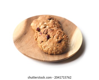 Cranberry Oatmeal Cookies On Round Wooden Board On White Background