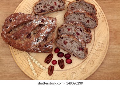 Cranberry And Pecan Bread On A Beech Wood Bread Board Over Oak Background.