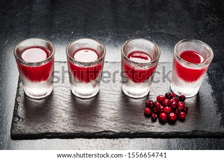 cranberry shots on the black background