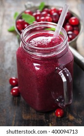 Cranberry smoothie on rustic wooden background - Healthy eating, Detox or Diet concept
