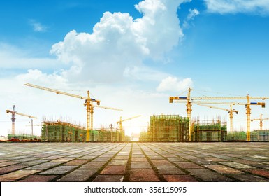 Crane   building construction site against blue sky