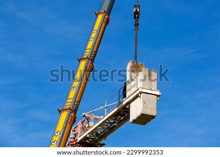 Crane disassembly, separation of components and removal of counterweights.