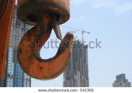 Crane Hook with constuction sites in background