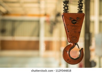 Crane hook Red yellow old In the factory Control tools Moving of large Made of steel Working with machinery transport - Powered by Shutterstock