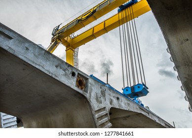 Crane Lifting Concrete Units Of Crown Princess Mary Bridge, A Construction Site  In Fredrikssund, Denmark, September 23, 2018