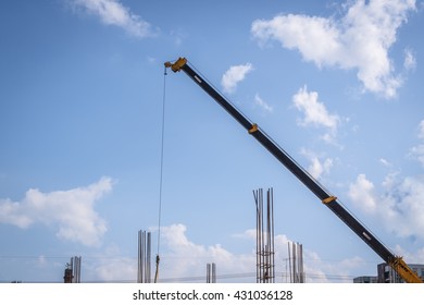 Crane lifting construction materials.