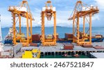 Crane loading box container to cargo ship at commercial dock port. Shipyard Cargo Container Sea Port Freight forwarding service logistics and transportation. International Shipping  Customs Port.	

