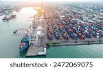 Crane loading box container to cargo ship at commercial dock port. Shipyard Cargo Container Sea Port Freight forwarding service logistics and transportation. International Shipping Depot