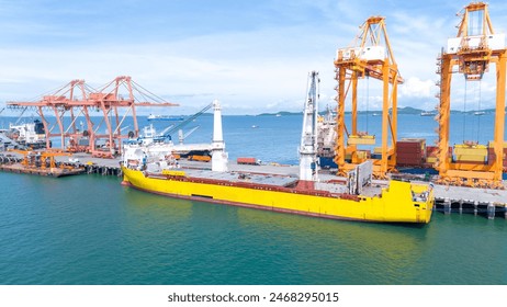 Crane loading box container to cargo ship at commercial dock port. Shipyard Cargo Container Sea Port Freight forwarding service logistics and transportation. International Shipping Customs Port.