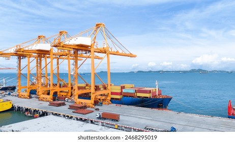Crane loading box container to cargo ship at commercial dock port. Shipyard Cargo Container Sea Port Freight forwarding service logistics and transportation. International Shipping  Customs Port.	