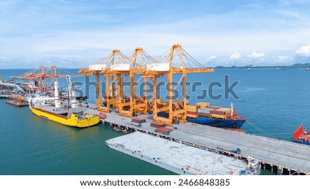 Crane loading box container to cargo ship at commercial dock port. Shipyard Cargo Container Sea Port Freight forwarding service logistics and transportation. International Shipping  Customs Port.	