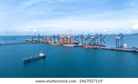 Crane loading box container to cargo ship at commercial dock port. Shipyard Cargo Container Sea Port Freight forwarding service logistics and transportation. International Shipping  Customs Port.	
