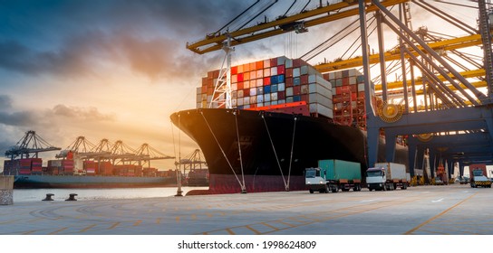 crane loading cargo container from truck to container ship in the international terminal logistic sea port concept freight shipping by ship 