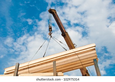 crane loading timber on pallet - Shutterstock ID 102975314