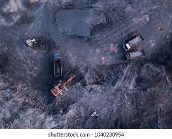 Crane And Lorries Clearing Land For Site Construction