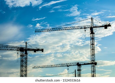 Crane  machine on cloudy sky background