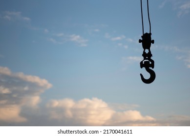 Crane On A Side With A Warm Sky In Background, Boat Hook Or Heavy Lift Concept