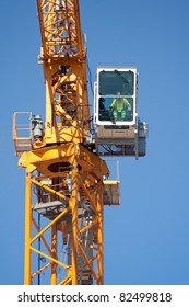 Crane Operator Sitting In His Cabin In Construction Site