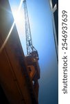 a crane positioned above the drydock which is operating during working hours