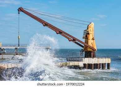 Crane In The Sea Port At Stormy Sunny Day.