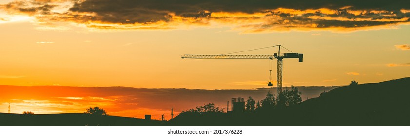 crane at sunset construction work