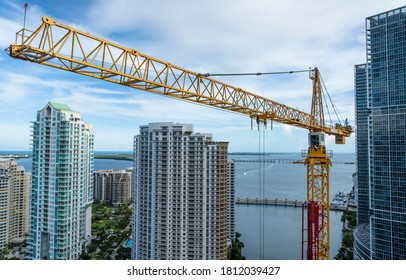 Crane Towering Over Brickell Key Skyline At Luxury Condo Skyscraper Construction Site In Downtown Miami 