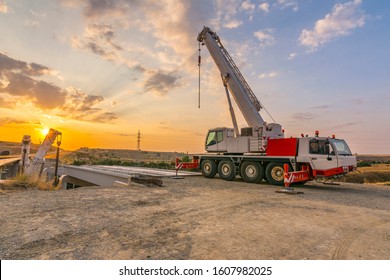 Crane trucks in the construction of a bridge