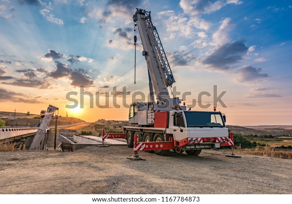 Crane trucks in
the construction of a
bridge