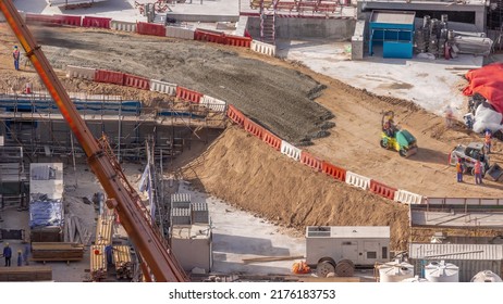 Cranes, Bulldozers And Roller Working At Construction Site Of New Skyscraper Aerial. Land Clearing, Grading, Pool Excavation, Utility Trenching And Foundation Digging. Crawler Tractor And Earth-moving