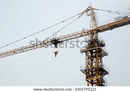 Cranes, heavy equipment to help build buildings, lift objects horizontally with a pulley system