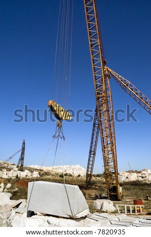 Cranes and marble blocks at a quarry near Vila Viçosa, Alentejo, Portugal