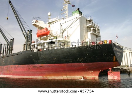 Cranes on a container ship reddy to load cargo