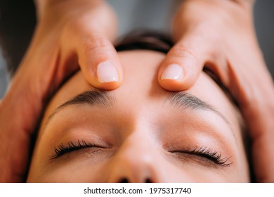 Craniosacral Therapy Massage. CST therapist Massaging of Woman’s Head.