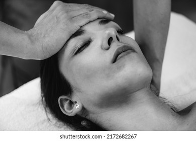Craniosacral Therapy Massage. CST therapist Massaging of Woman’s Head.