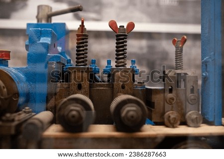 Cranks and knobs in a pencil manufacturing machine.