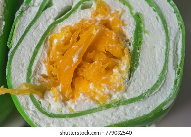 Crape cream roll wrap with soft green crape with sweet yoke egg in the middle.