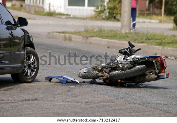 crash moto bike and car on\
road