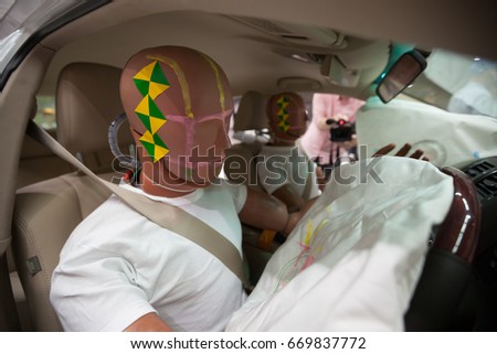 Crash Test Dummies in a car after a Crash Test.