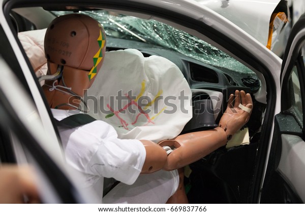 Crash Test\
Dummies in a car after a Crash\
Test.