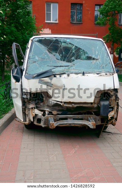 crashed\
after a road accident minibus parked on a\
walkway