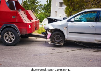 Crashed Car After Accident Ready To Be Tow Away By Tow Truck