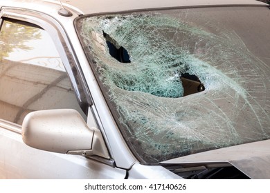 Crashed car with broken windshield, transportation accident