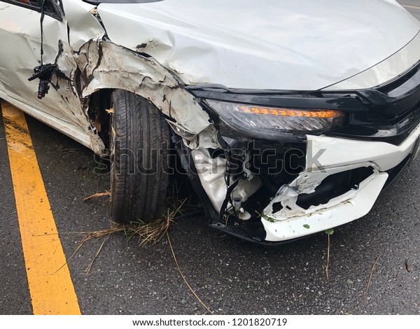 Crashed car on the\
road