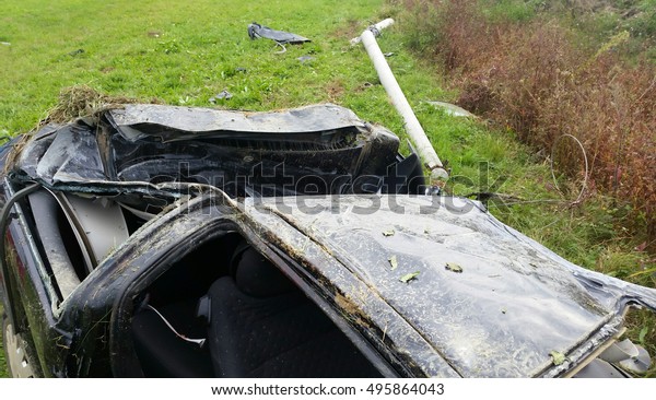 crashed car in scary\
accident on road
