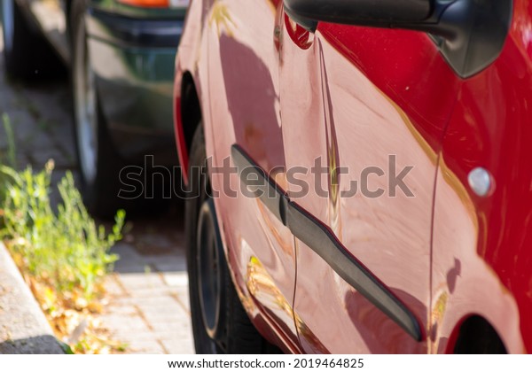 Crashed and dented car door is totally demolished\
after a heavy car accident with a write-off for the car insurance\
or repair needs with hit-and-run after collision for car insurance\
in traffic injury