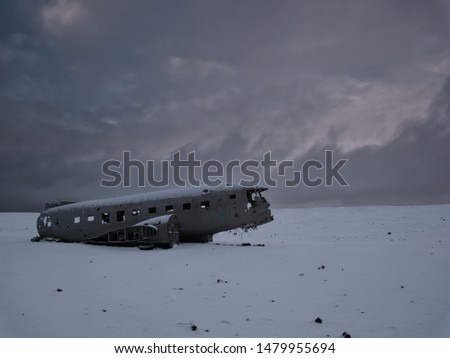 Crashed plane on a snowy field. Photo from March in Iceland